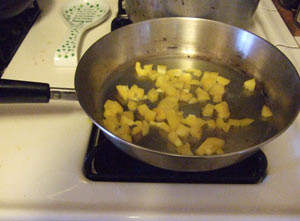 Frying up some yellow bell peppers.