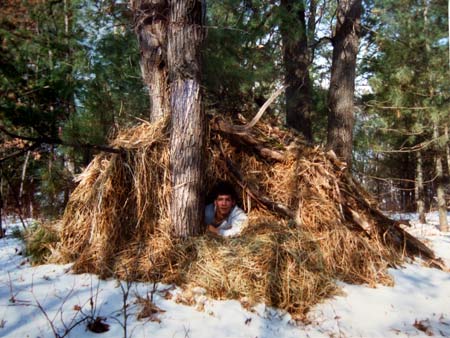 A debris hut made of grasses and leaves I stayed in when it was -19 F.