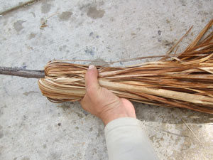folding the brush back on your outdoor broom