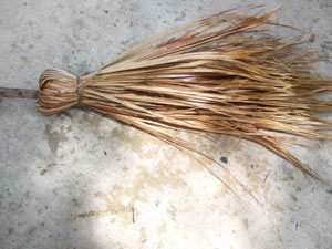 Tie down the bristles of the broom